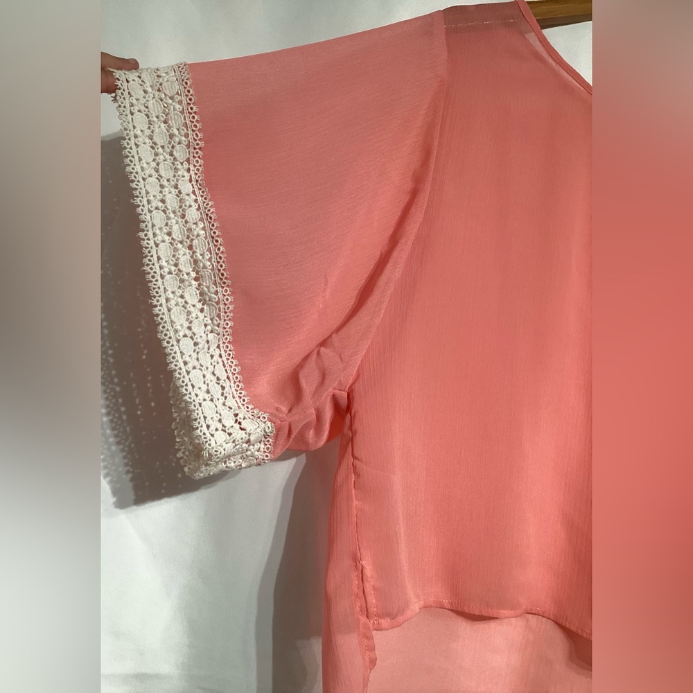 umgee peachy pinkish sheer blouse with cream color embroidery accenting sleeves.